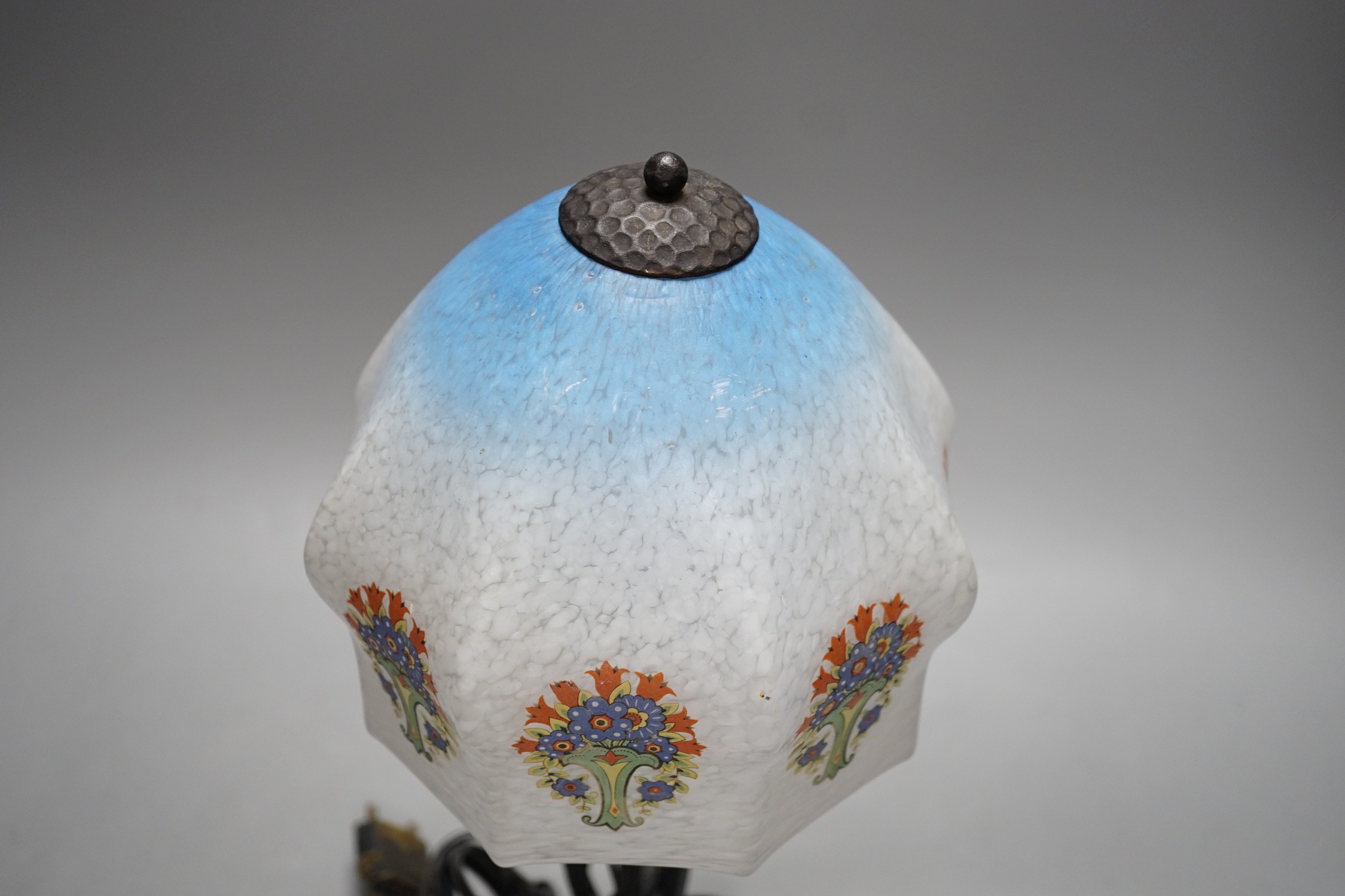 An Art Deco wrought iron table lamp on tripod base with frosted glass shade, 38cm tall